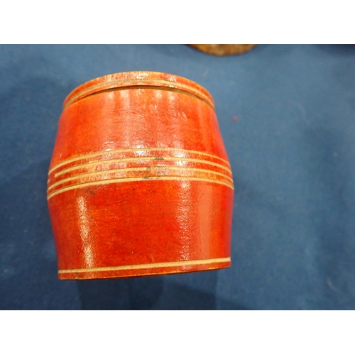 425 - A red coloured barrel-shaped Box and Cover, the base inscribed John Moon, 1799, 2¾in H, a cylindrica... 