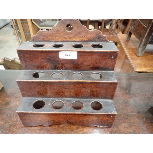 477 - An 18th Century Welsh oak Spoon Rack with raised shaped top, three tiers, cupids bow cut out design ... 