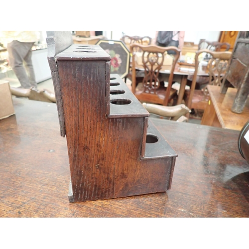 477 - An 18th Century Welsh oak Spoon Rack with raised shaped top, three tiers, cupids bow cut out design ... 