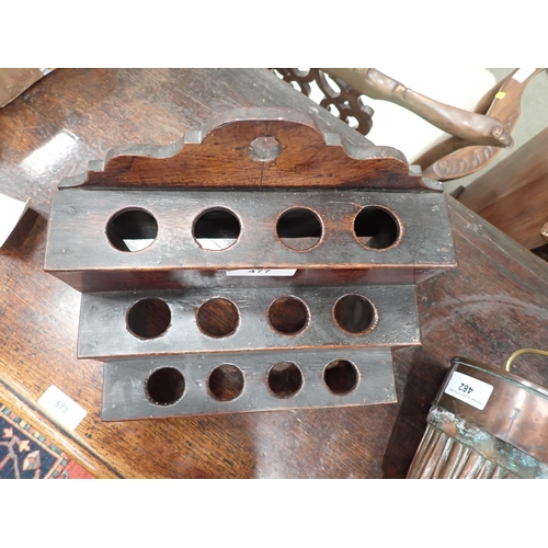 477 - An 18th Century Welsh oak Spoon Rack with raised shaped top, three tiers, cupids bow cut out design ... 