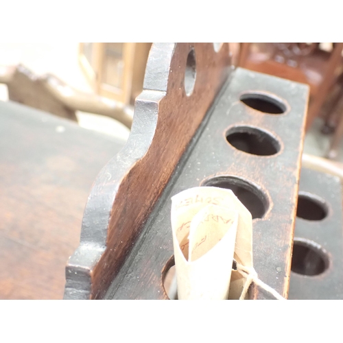 477 - An 18th Century Welsh oak Spoon Rack with raised shaped top, three tiers, cupids bow cut out design ... 