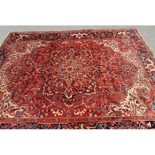 1 - A large Persian Carpet, the wide border with stylised motifs, the center ground with floral designs ... 