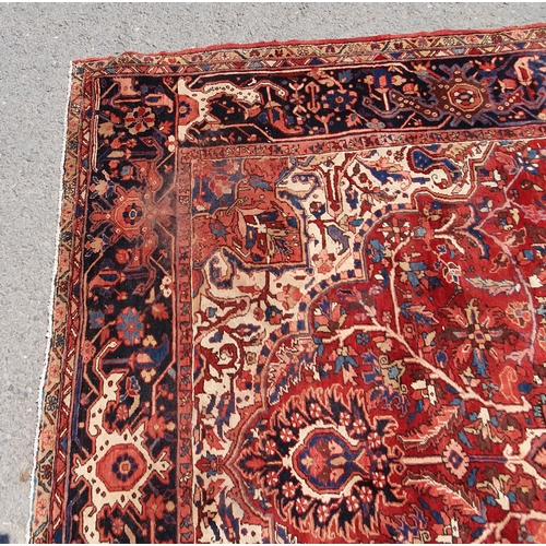 1 - A large Persian Carpet, the wide border with stylised motifs, the center ground with floral designs ... 