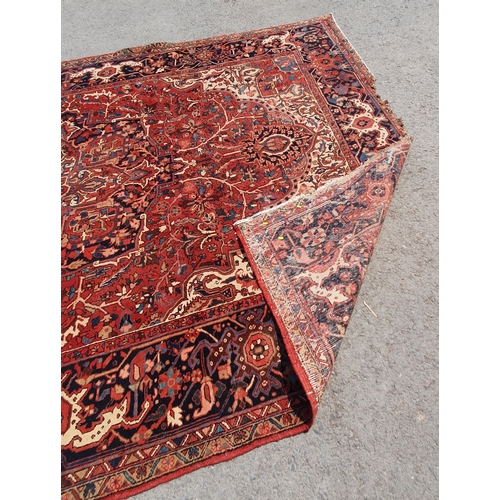 1 - A large Persian Carpet, the wide border with stylised motifs, the center ground with floral designs ... 