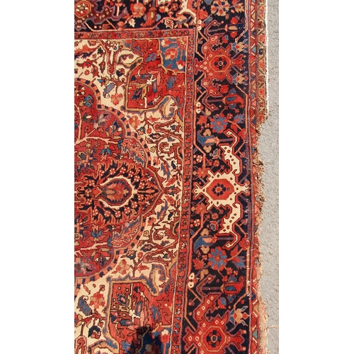 1 - A large Persian Carpet, the wide border with stylised motifs, the center ground with floral designs ... 