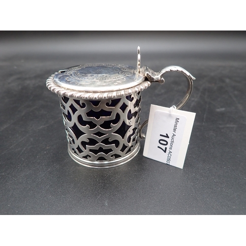 107 - A Victorian silver pierced drum Mustard Pot with gadroon rim, engraved lid, pierced thumb piece, blu... 