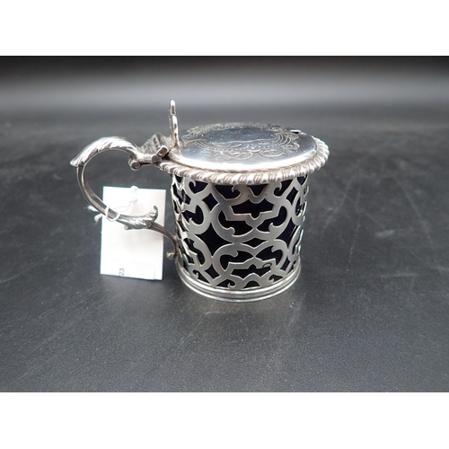 107 - A Victorian silver pierced drum Mustard Pot with gadroon rim, engraved lid, pierced thumb piece, blu... 