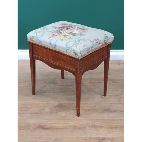 11 - An Edwardian Rosewood inlaid Piano Stool with floral upholstered top on tapered supports with brass ... 