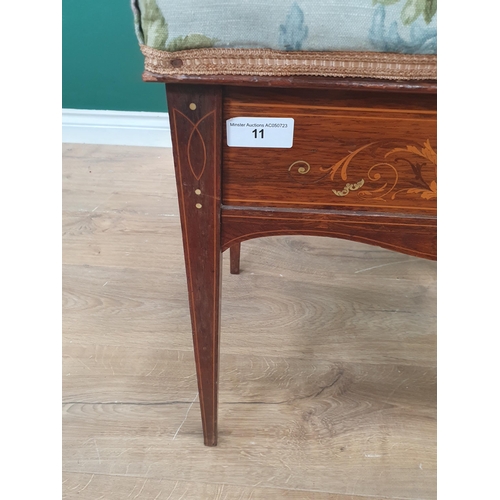 11 - An Edwardian Rosewood inlaid Piano Stool with floral upholstered top on tapered supports with brass ... 