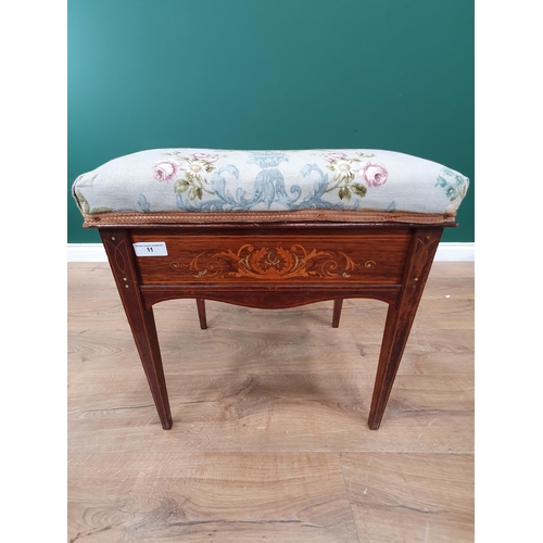 11 - An Edwardian Rosewood inlaid Piano Stool with floral upholstered top on tapered supports with brass ... 