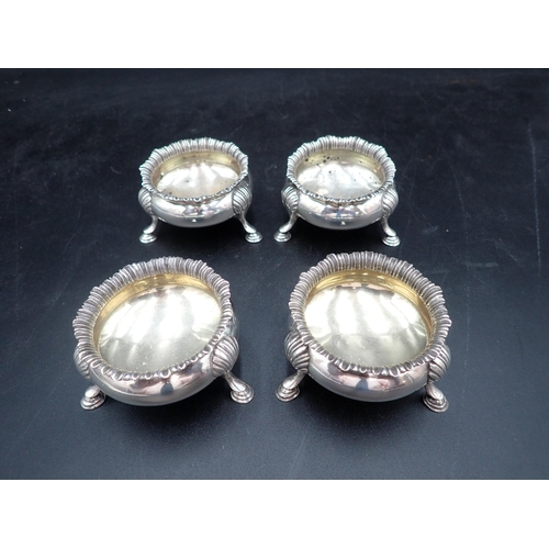 116 - A set of four Victorian silver cauldron Salts with shaped rims on hoof feet, London 1898  335gms