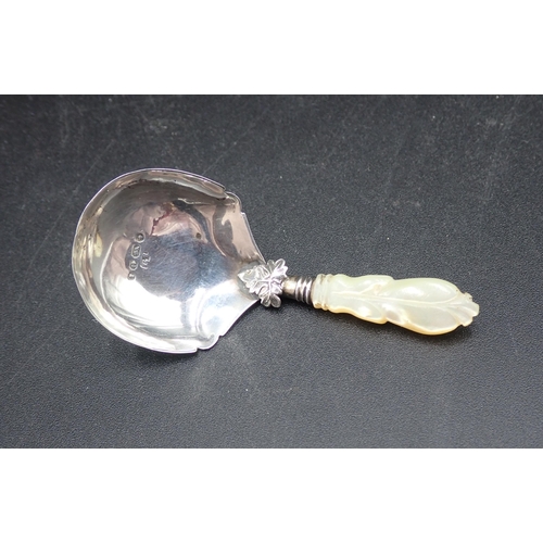 124 - A Victorian silver Caddy Spoon with mother of peal handle, Birmingham 1868  maker George Unite