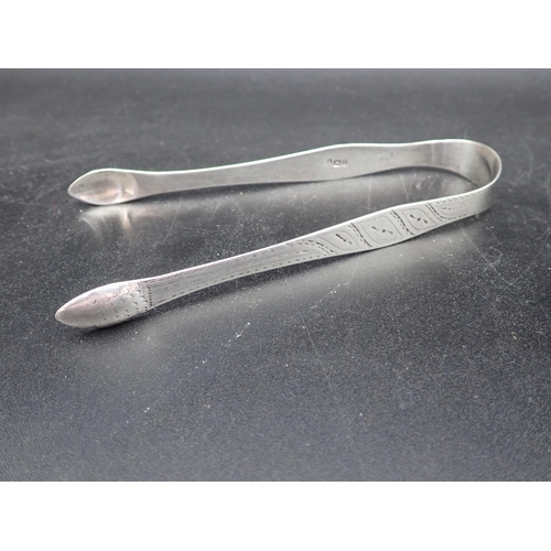 131 - A pair of George V silver 'Chippendale' Sugar Tongs, Sheffield 1911, a pair of bright cut Tongs, Lon... 