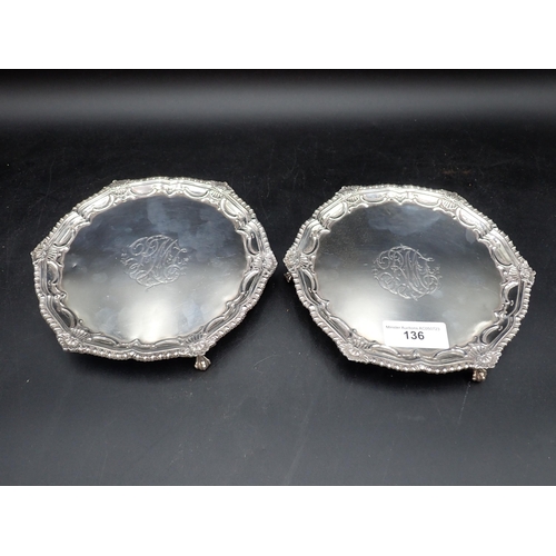 136 - A pair of George III silver circular Waiters with shell and gadroon rims, engraved initials, on ball... 