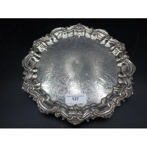 137 - An Edward VII silver circular Salver with scroll engraving and initials, shaped rim on three scroll ... 