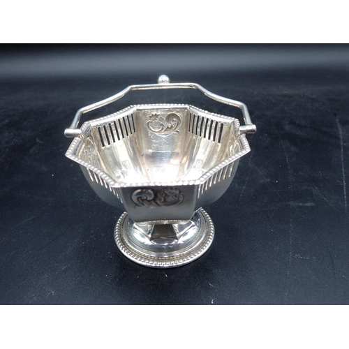 139 - An Edward VII silver octagonal Basket with pierced frieze, swing handle on pedestal base, Birmingham... 