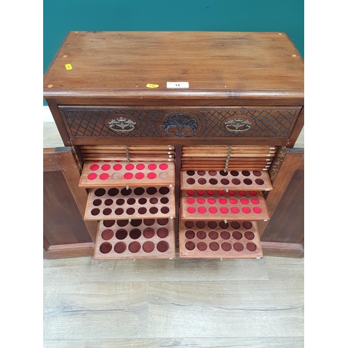 14 - A hardwood Coin Collectors Cabinet fitted with 82 slides with various coin sizes and single drawer t... 