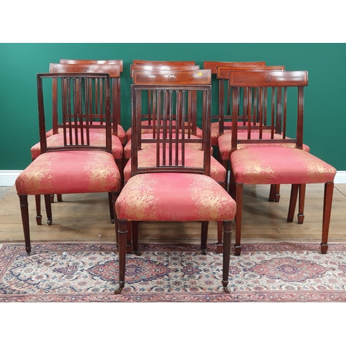 15 - A set of eight mahogany Dining Chairs with crossbanded backs supported on Spade feet with pink and g... 