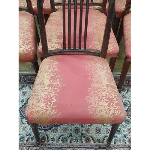 15 - A set of eight mahogany Dining Chairs with crossbanded backs supported on Spade feet with pink and g... 