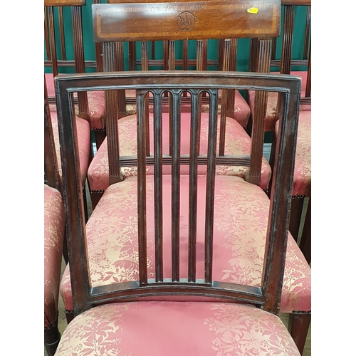 15 - A set of eight mahogany Dining Chairs with crossbanded backs supported on Spade feet with pink and g... 