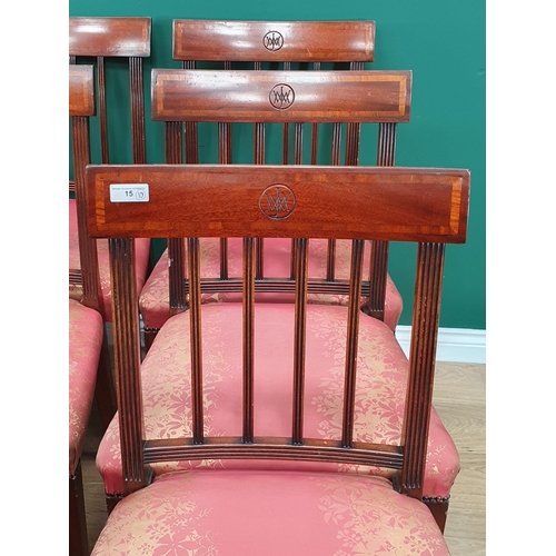 15 - A set of eight mahogany Dining Chairs with crossbanded backs supported on Spade feet with pink and g... 