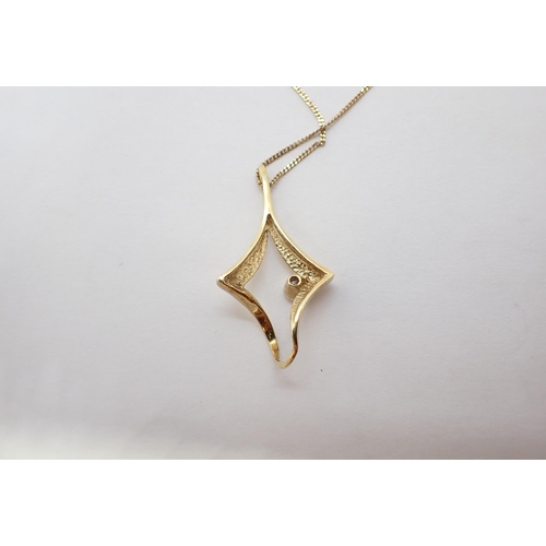 172 - A Diamond Pendant the irregular frame rubover-set single brilliant-cut stone, marked 14K on fine cha... 