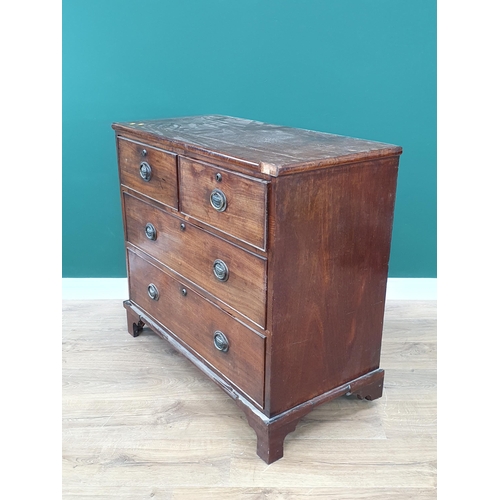 18 - A Mahogany Chest of two short and two long Drawers supported on Bracket feet with brass urn handles ... 