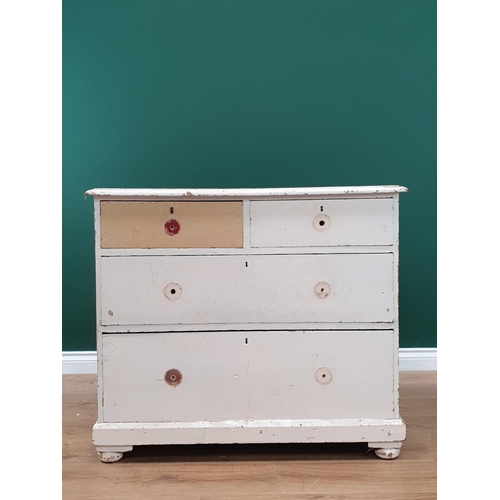 21 - A white painted pine Chest of two short and two long Drawers supported on bun feet A/F, 2ft 7