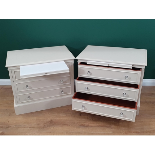 274 - A pair of white painted Bedside Chests of three long Drawers with fitted slides, 2ft High x 2ft 4