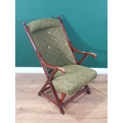 282 - An Edwardian walnut framed Armchair with green upholstery