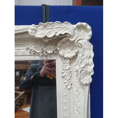 299 - A large white painted modern Wall Mirror with with floral and leafage decorated frame, 5ft 8