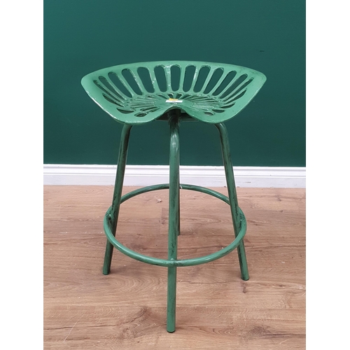 32 - A green painted metal Tractor Seat breakfast Bar Stool.