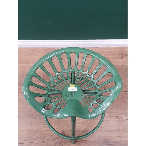 32 - A green painted metal Tractor Seat breakfast Bar Stool.