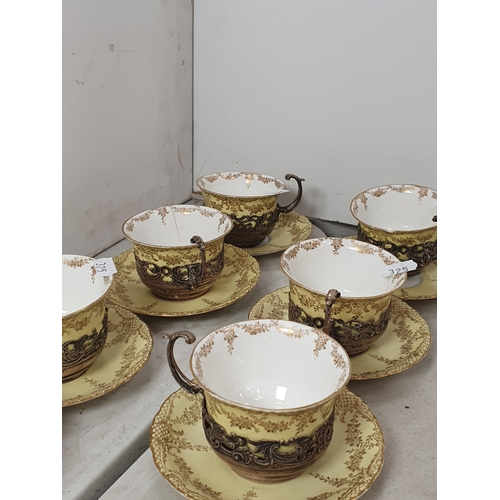 325 - A Pearlware Plate with floral decorated rim and central Poem, and Six yellow and gilt decorated Staf... 