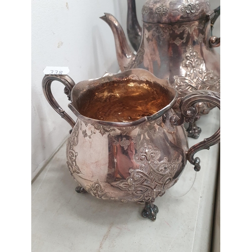 338 - A plated three piece Tea and Coffee Service with embossed decoration