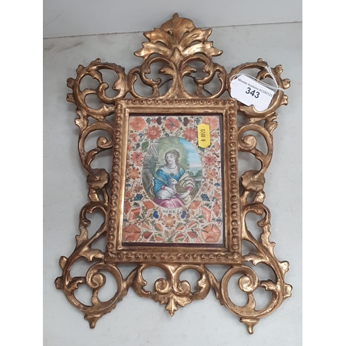 343 - A straw-work Panel surrounding a depiction of St. Agnes in a gilt baroque style frame, 13in H overal... 