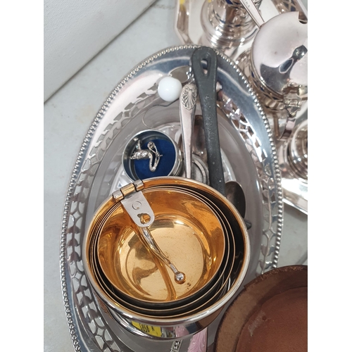 359 - A quantity of plated items including Condiment Set, folding Cup in leather case, Tea Service etc