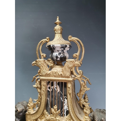 369 - A French style gilt metal Mantel Clock with lyre design, the circular dial flanked by cherub figures... 