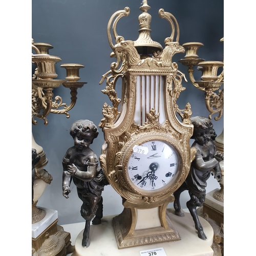 370 - A French style gilt and marble three piece Clock Garniture, the clock with lyre design flanked by ch... 