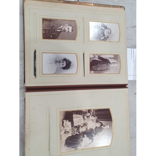 373 - A Victorian leather Photograph Album with brass clasp and containing photographs