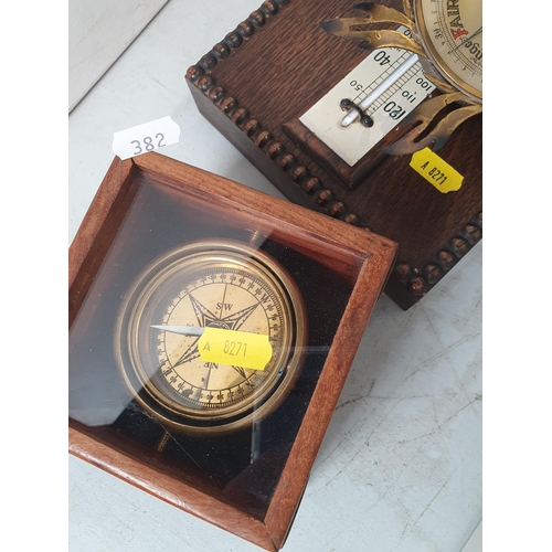 382 - An Art Deco oak Mantel Clock, an oak aneroid Barometer/Thermometer, a Compass on gimbol in case and ... 