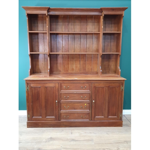 47 - A Large stained pine Dresser and Rack above two cupboard doors and four short drawers.