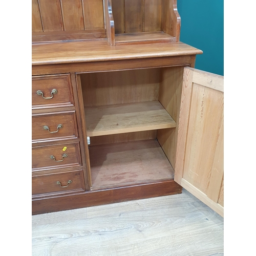 47 - A Large stained pine Dresser and Rack above two cupboard doors and four short drawers.