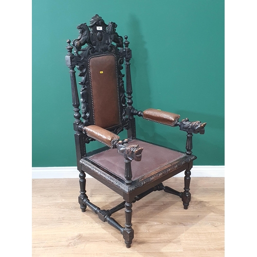 489 - An oak carved Elbow Chair with carved Lion top rail flanked by turned and fluted spindles, with brow... 