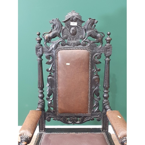 489 - An oak carved Elbow Chair with carved Lion top rail flanked by turned and fluted spindles, with brow... 