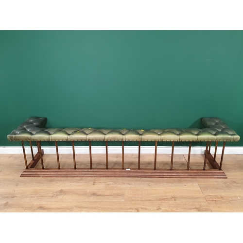 556 - A Club Fender with leather button upholstered seat with brass rails and oak base 7ft 10in L x 1ft 8i... 
