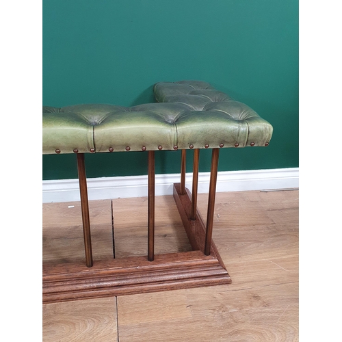 556 - A Club Fender with leather button upholstered seat with brass rails and oak base 7ft 10in L x 1ft 8i... 