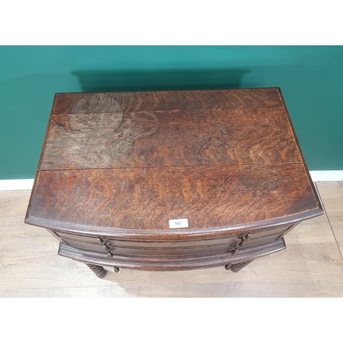 563 - An oak bow fronted Canteen Table by Mappin & Webb with four drawers part filled with plated cutlery ... 