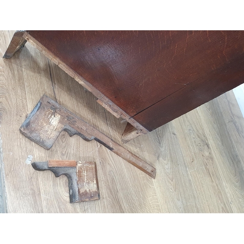 589 - A Georgian oak Bureau of small proportions fitted three graduated drawers and raised on shaped brack... 