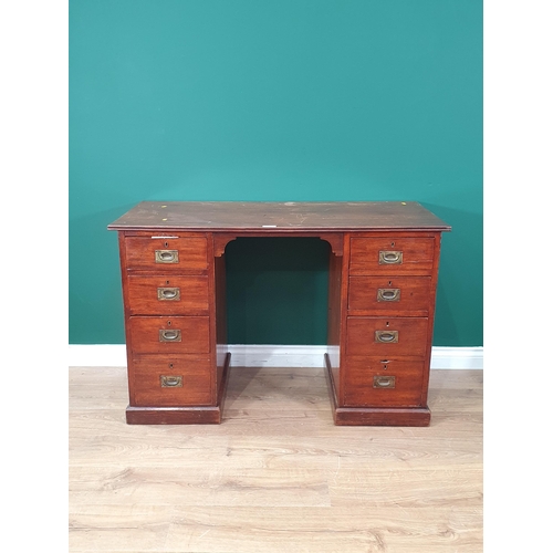 590 - An antique mahogany Campaign style Pedestal Desk fitted four drawers each side with brass inset hand... 